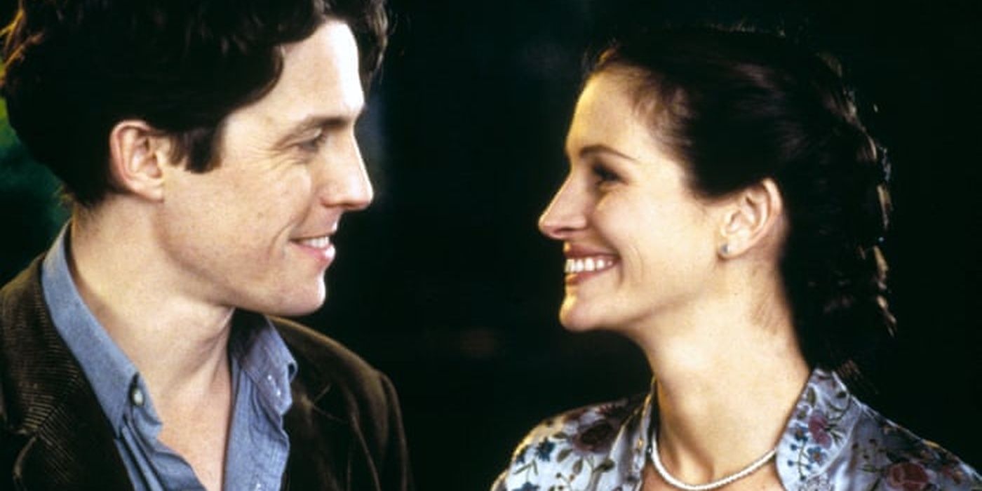 Hugh Grant and Julia Roberts smiling at each other in Notting Hill.