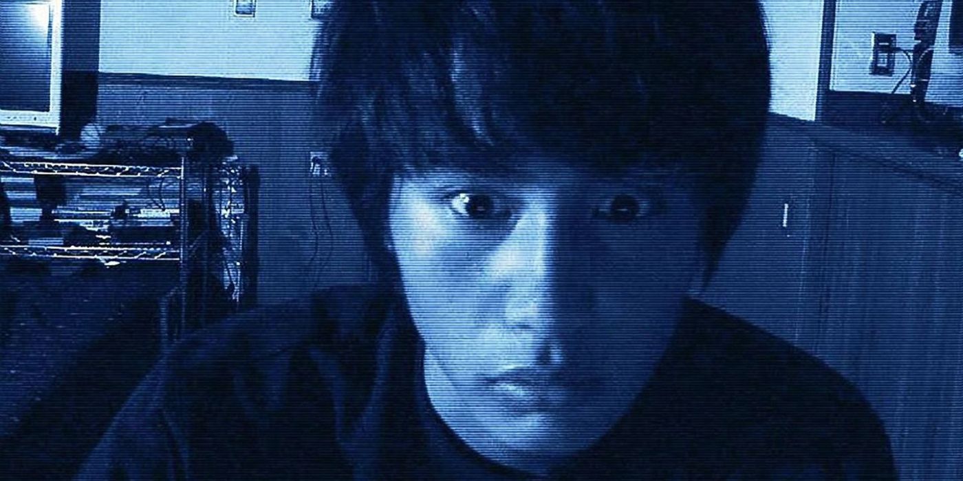 A young man looking afraid into the camera in Paranormal Activity 2: Tokyo Night