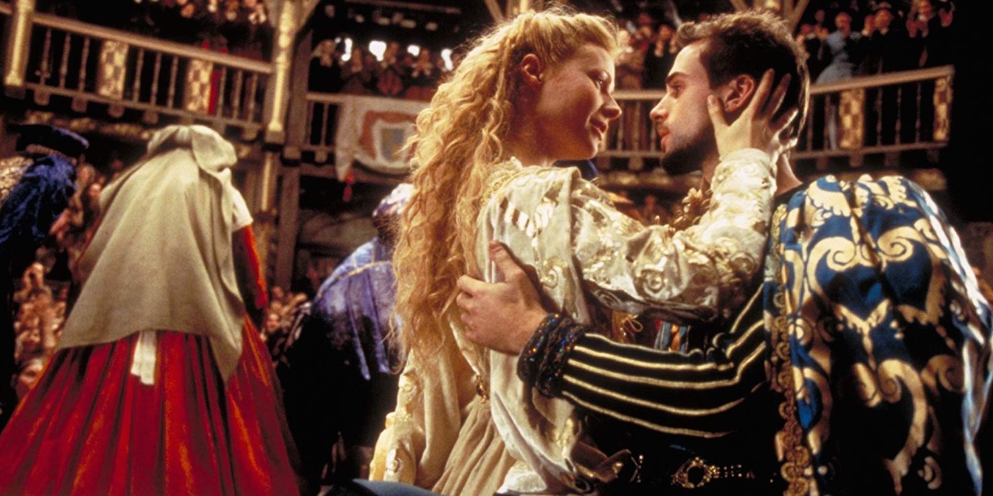 Gwyneth Paltrow and Ralph Fiennes star in Shakespeare in Love - the couple embraces in the middle of a ball.