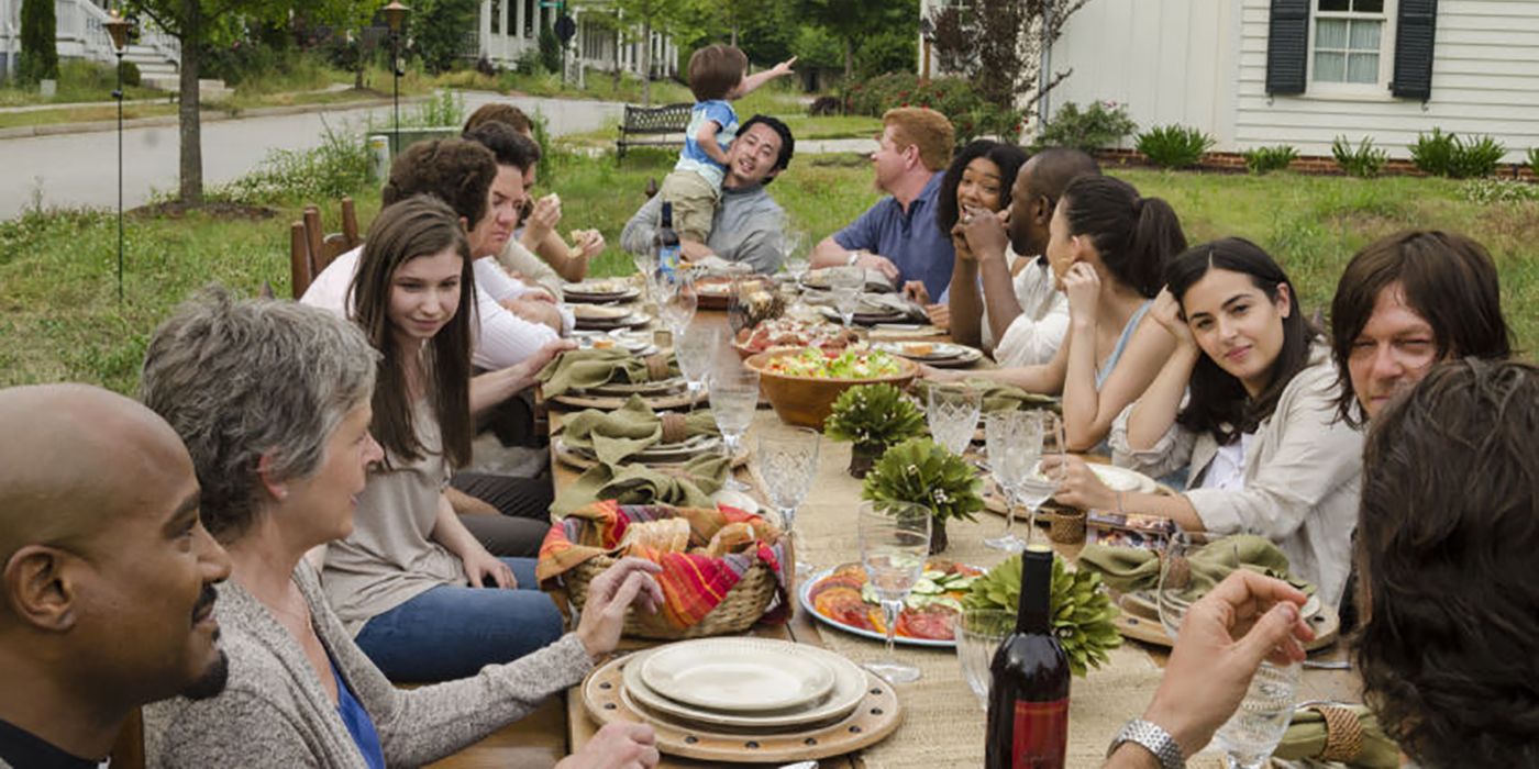 The Walking Dead characters at a table eating