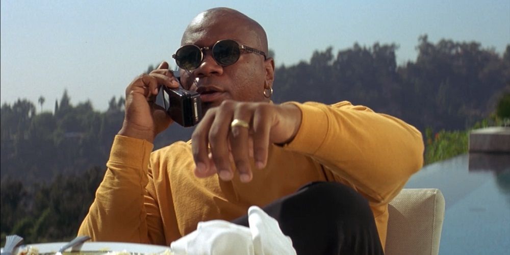 Ving Rhames as Marsellus Wallace sitting by his pool in Pulp Fiction