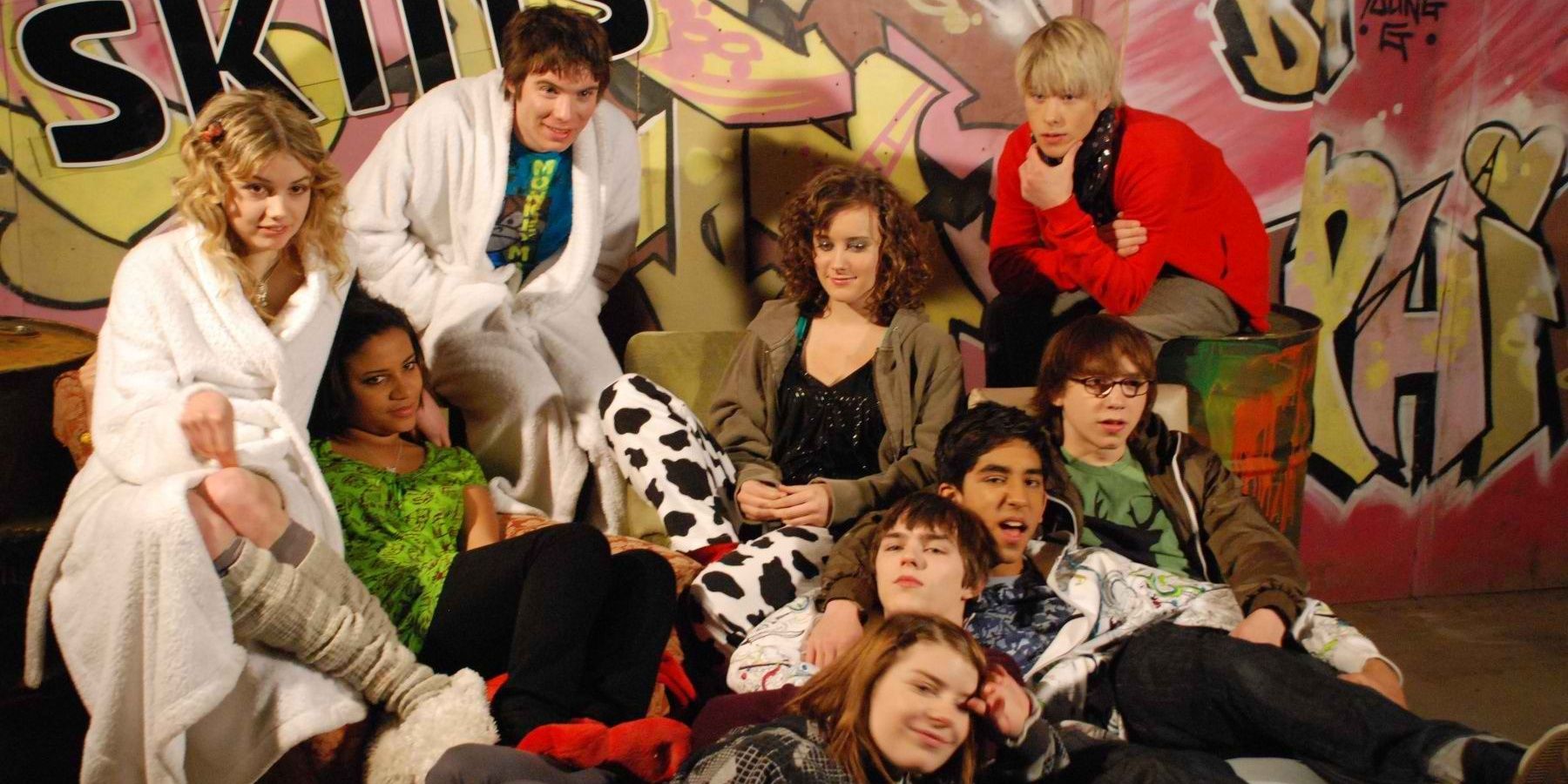 A promotional image of the nine main cast members of the first generation of Skins for Season 2 in front of a wall of graffiti