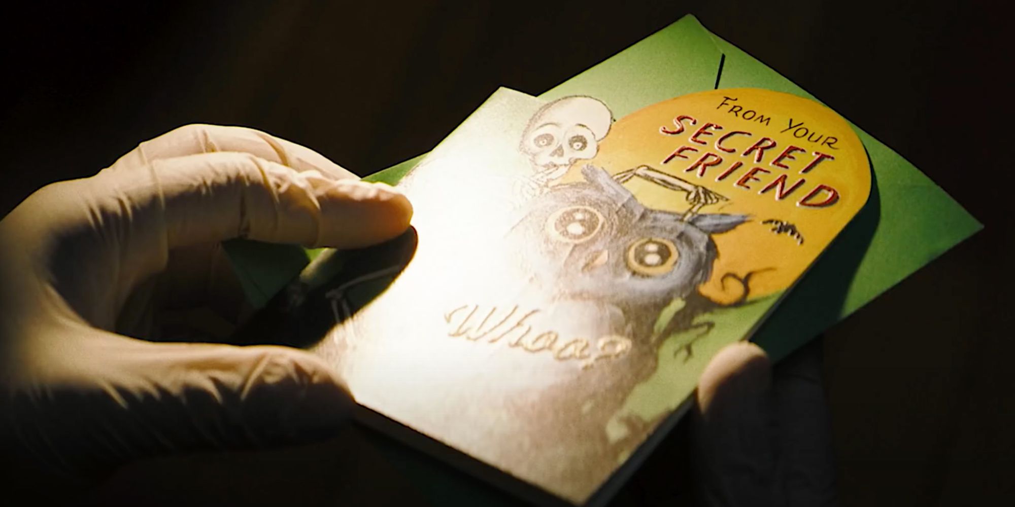 A still from The Batman trailer shows a card with an owl on it