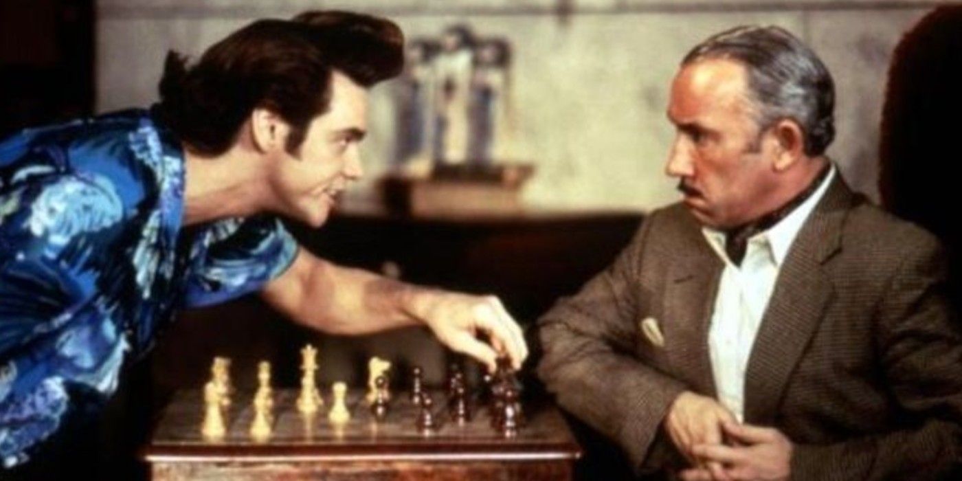 Jim Carrey playing chess with Simon Callow in Ace Ventura: When Nature Calls