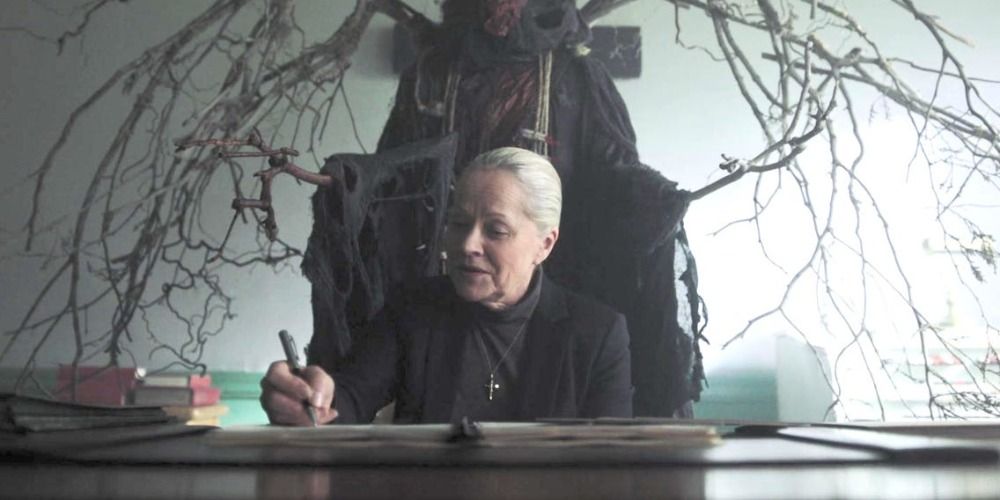 An image of Sister Woodhouse sitting behind her desk in Riverdale
