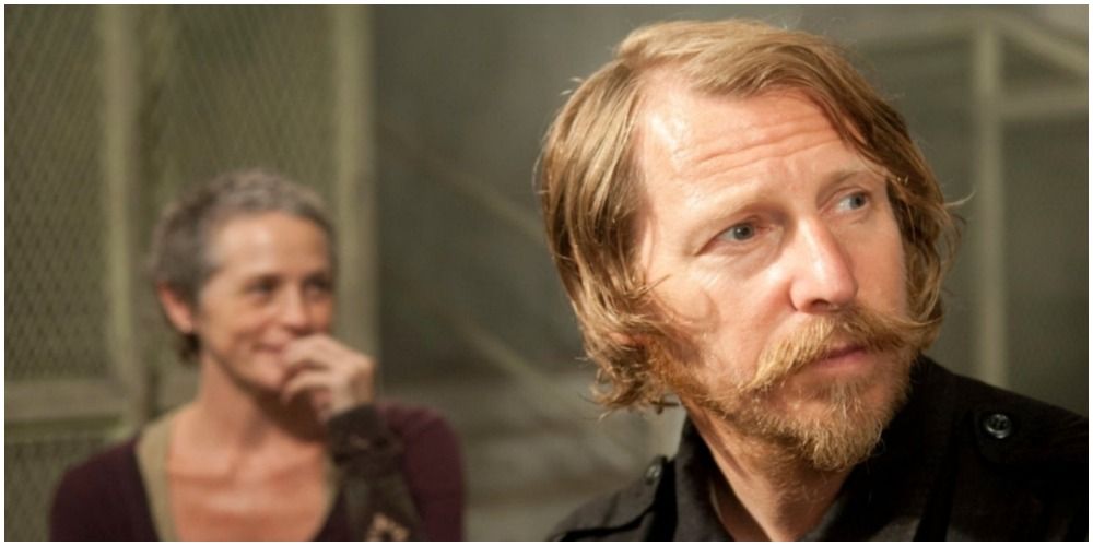 Lew Temple as Axel and Melissa McBride as Carol at the prison in The Walking Dead
