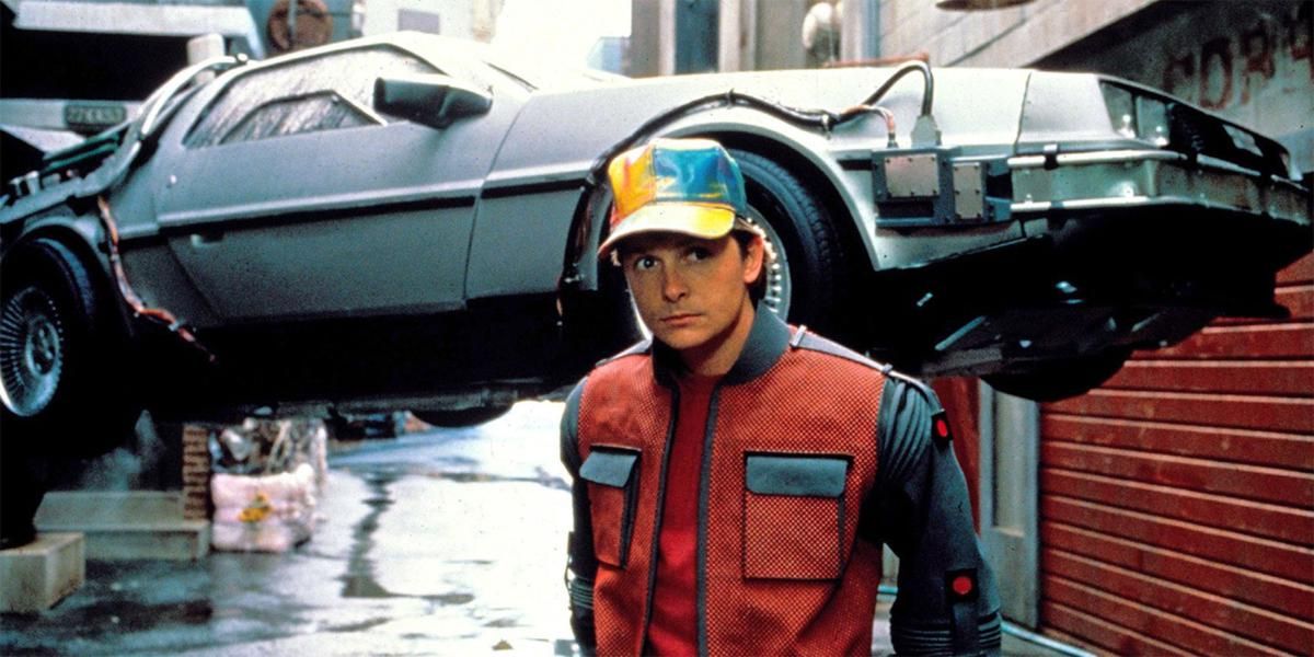 Marty McFly staring in to the distance with the Deloreon hovering behind him