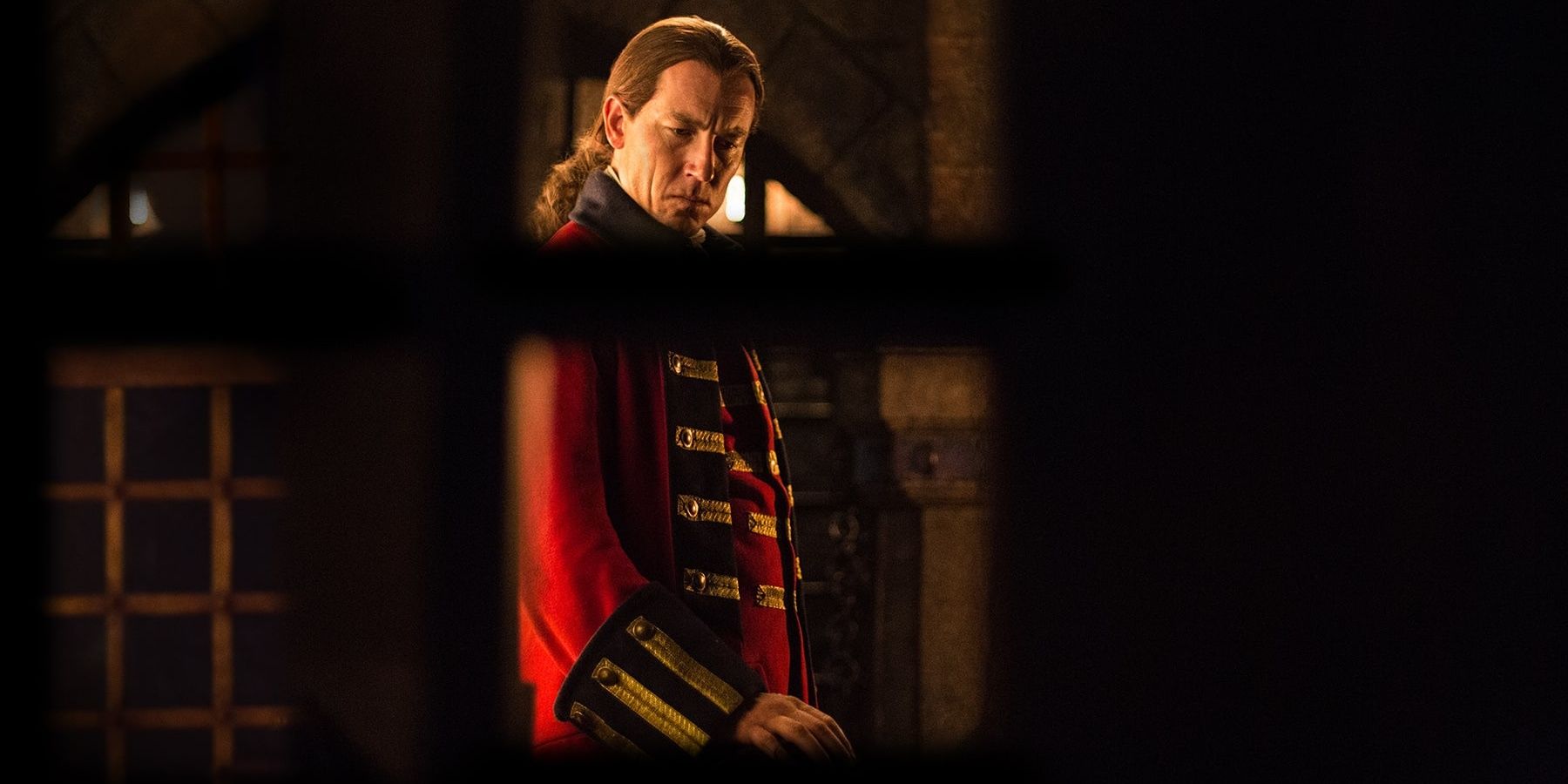 Black Jack stares at Jamie's cell in Outlander