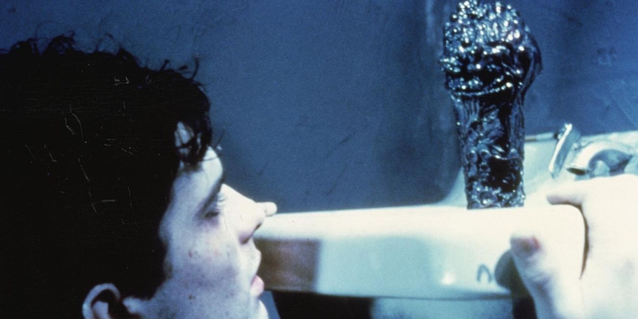 Rick Hearst and Elmur in Franke Hennenlotter's 1988 film Brain Damage