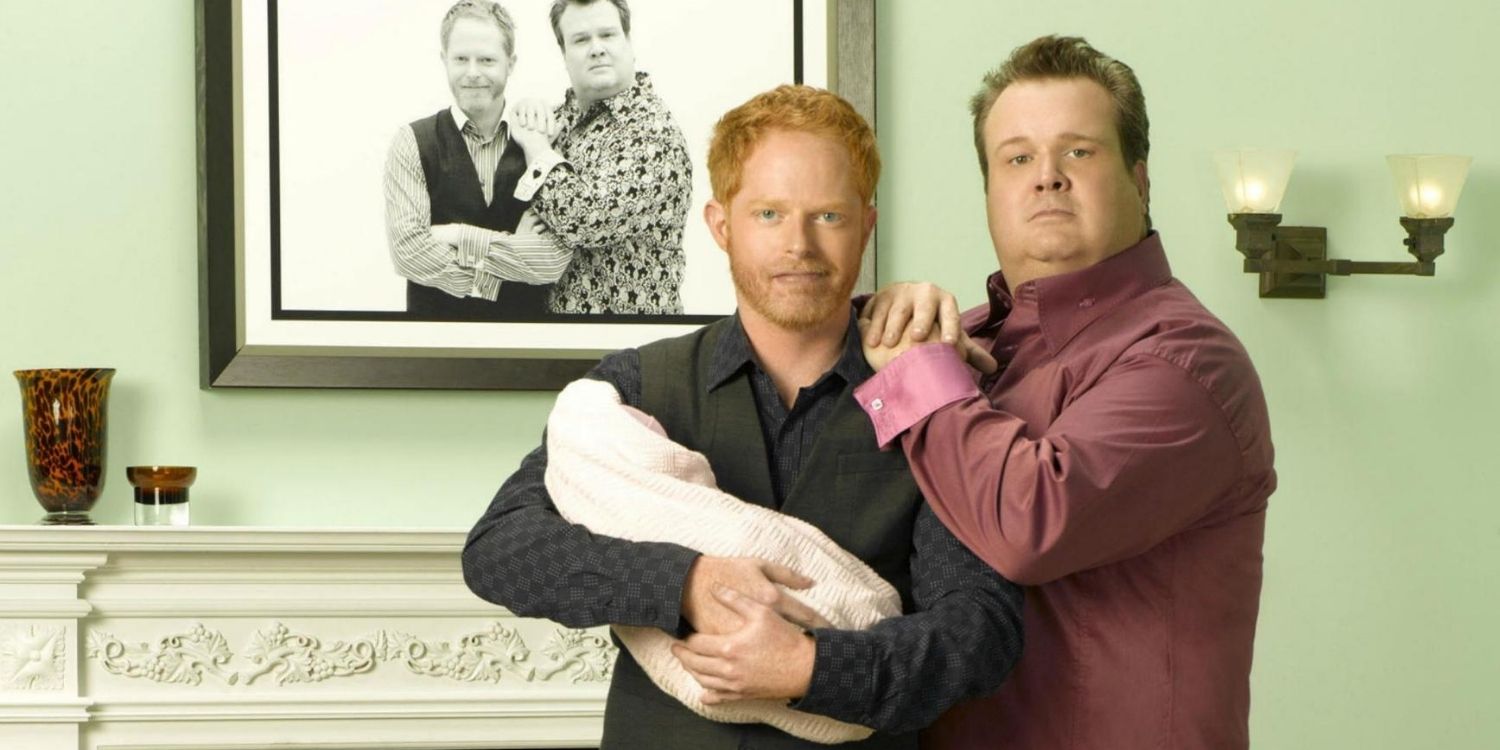 A family portrait of Mitch and Cam with Lily on Modern Family