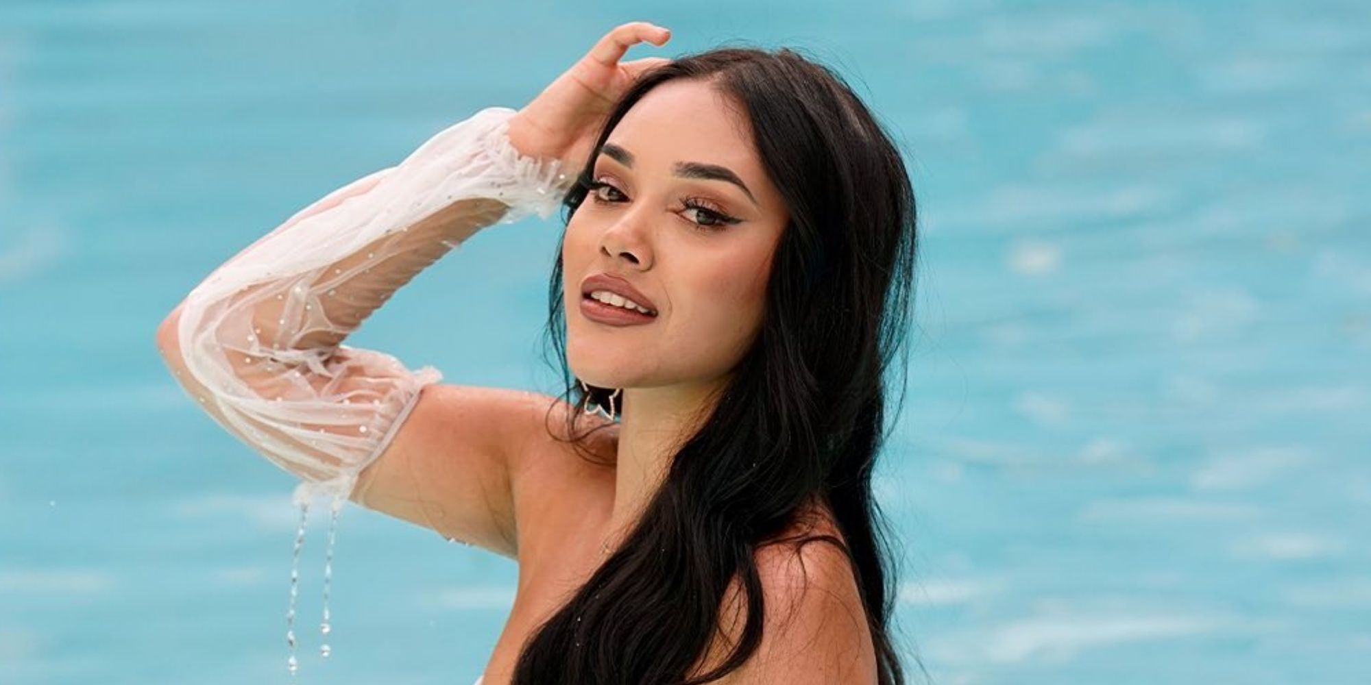 Cely Vazquez posing for the camera at the pool in Love Island USA