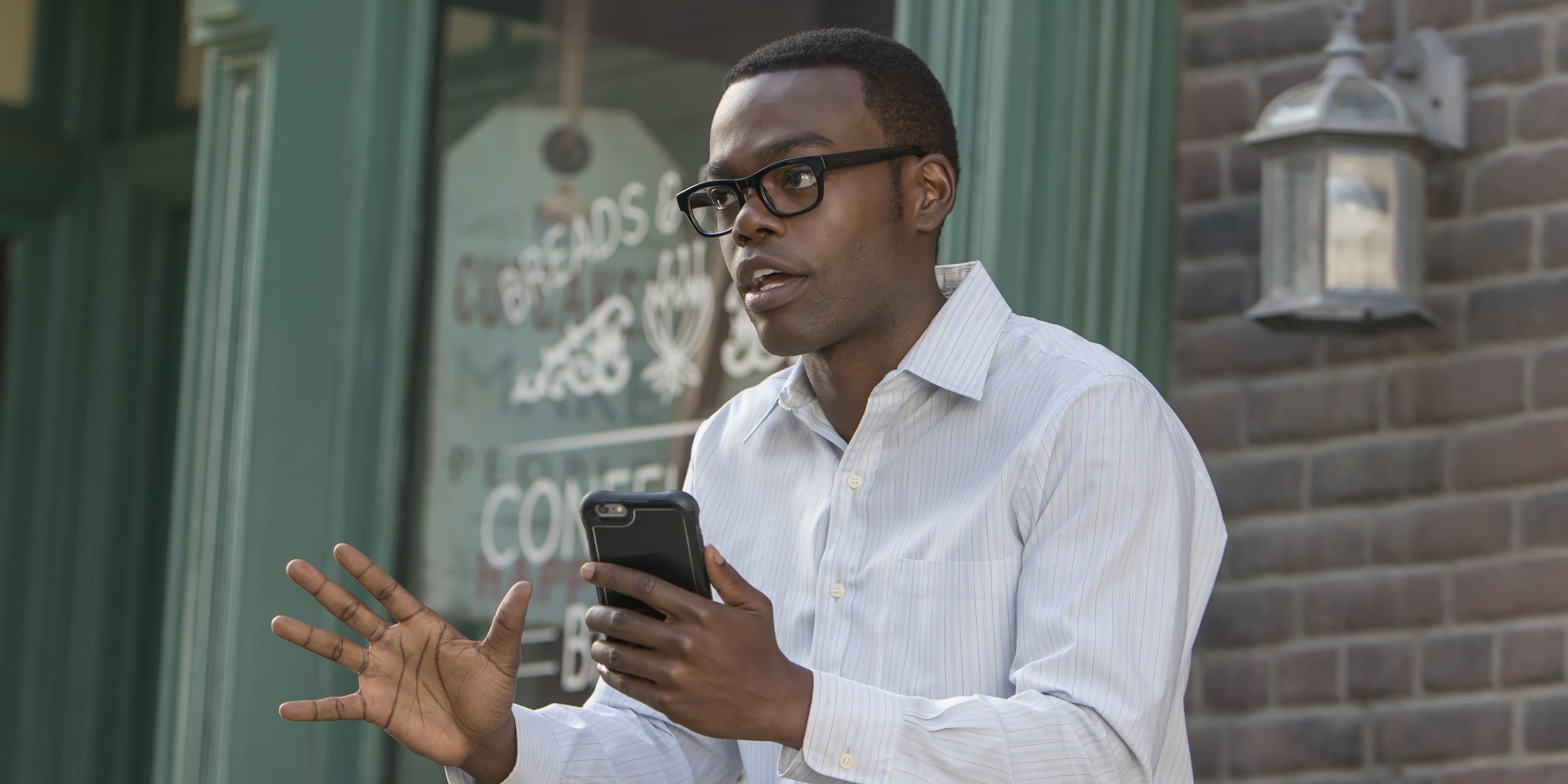 Chidi speaking on his phone in The Good Place