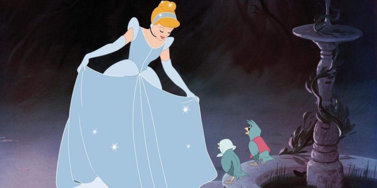 Cinderella looks at her new dress while her bird friends look on in Cinderella (1950)