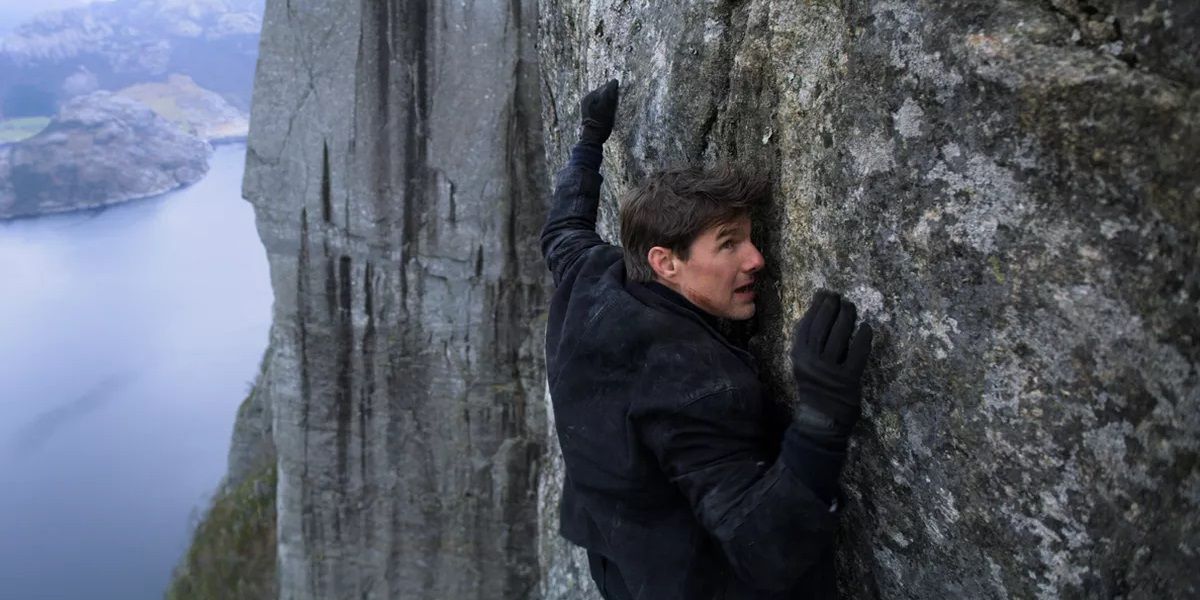 Tom Cruise hanging on a cliff