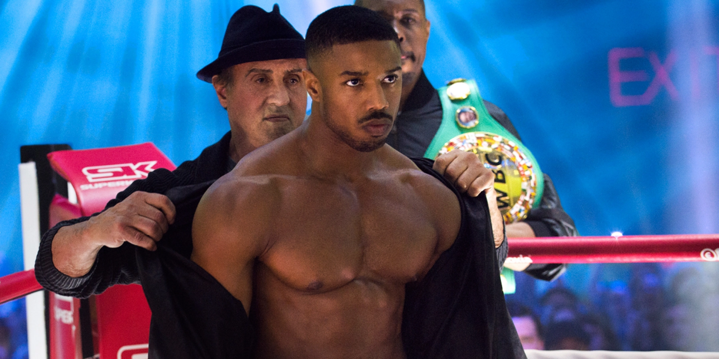 Sylvester Stallone removing Adonis' robe in the boxing ring in Creed II