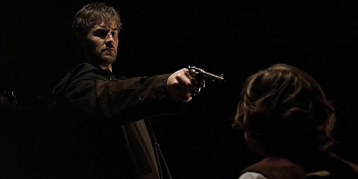 Tobias holding a gun on Reid in Criminal Minds episode Revelations