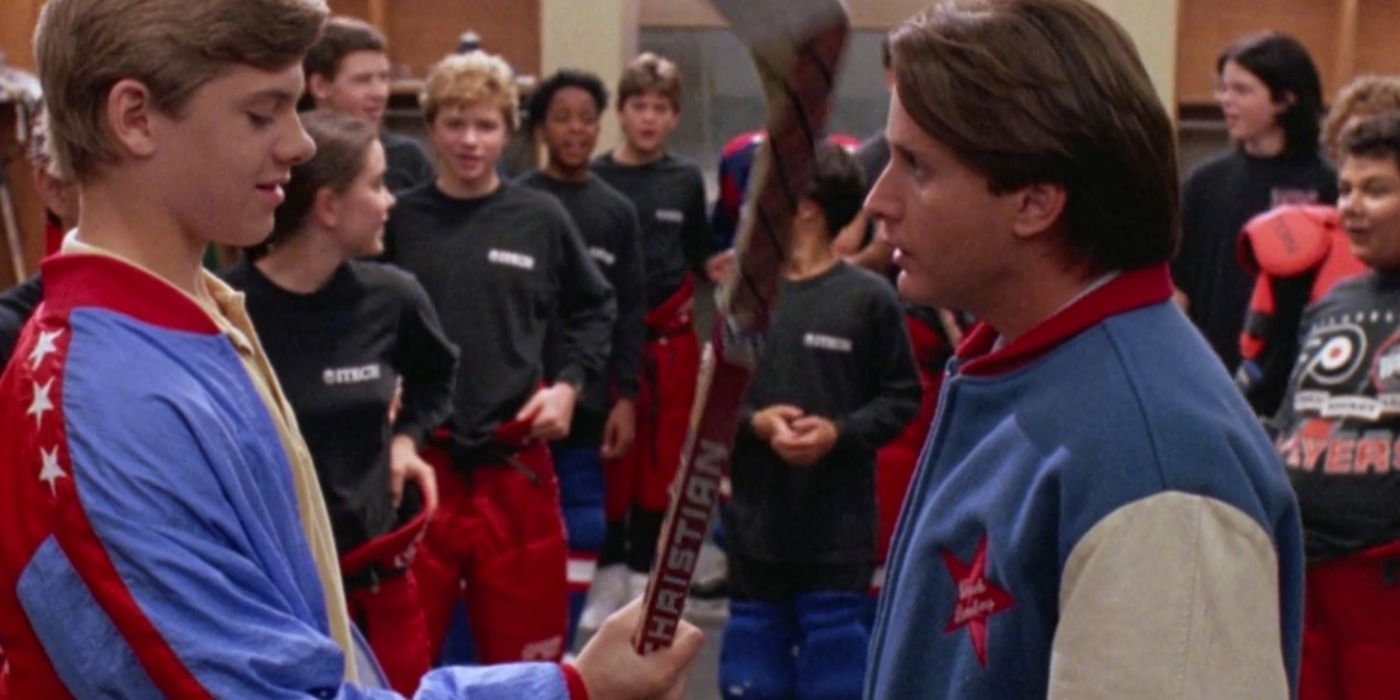 Coach Bombay speaks with Banks in front of the team in the locker room in The Mighty Ducks