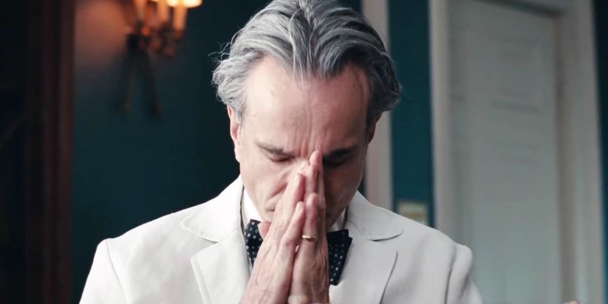 Reynolds rests his head on his hands in Phantom Thread