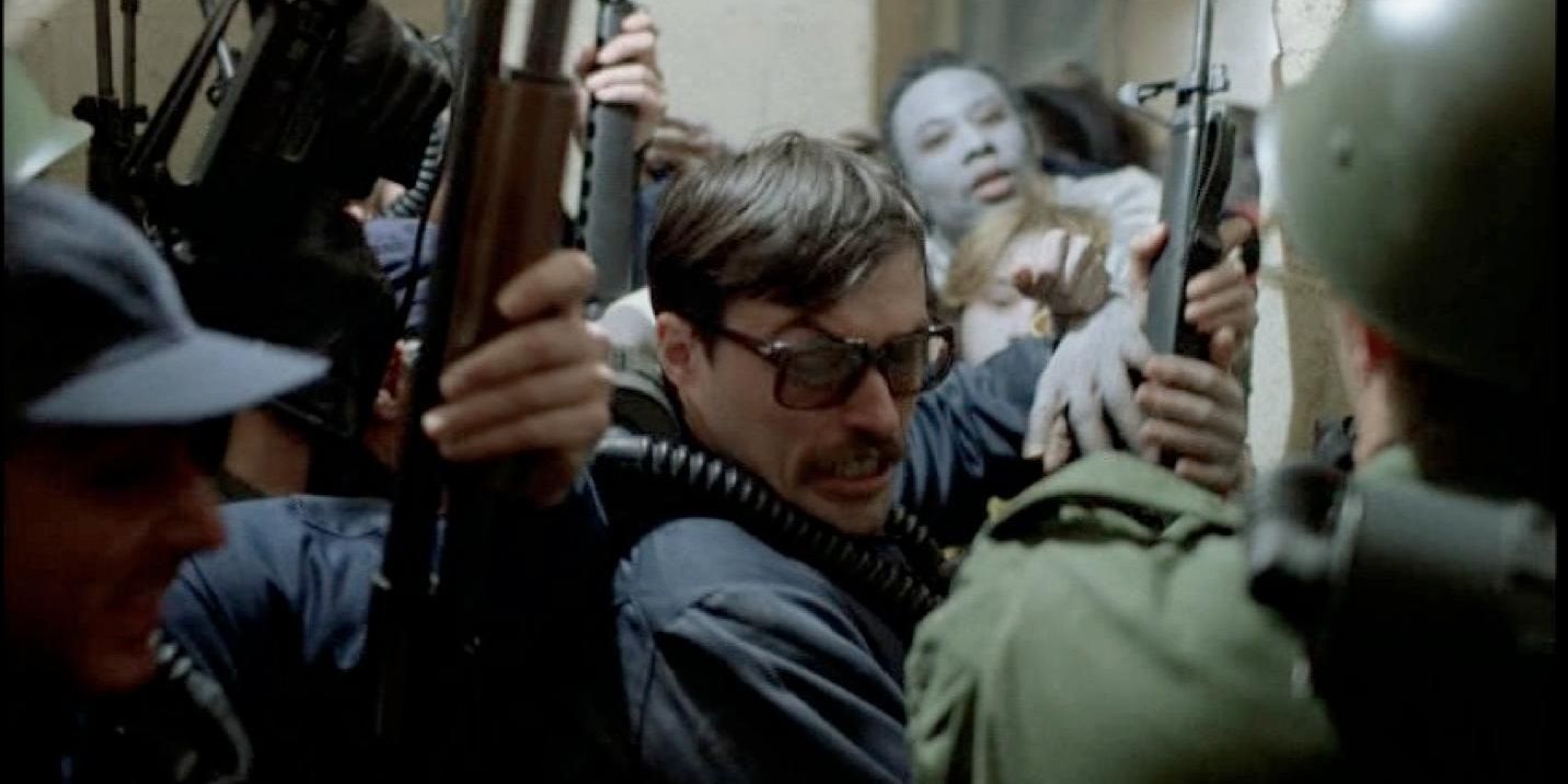 Zombies swarm characters in Dawn of the Dead 1978