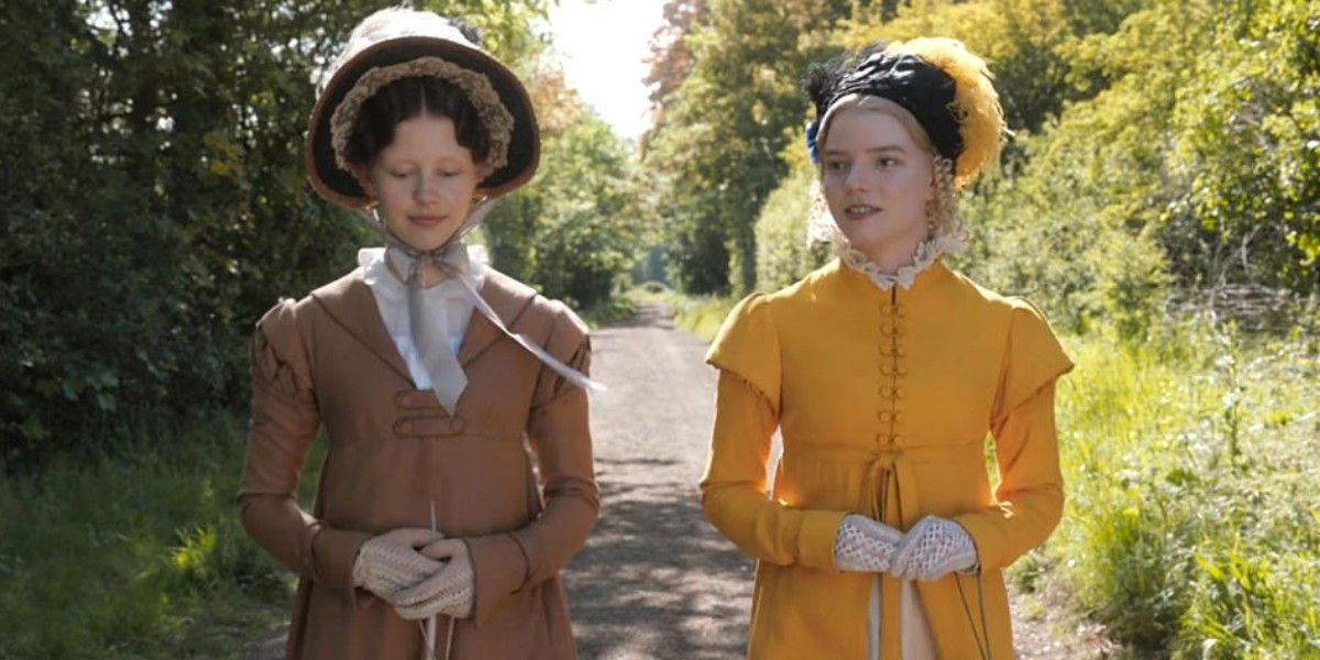 Mia Goth as Harriet Smith and Anya-Taylor Joy as Emma Woodhouse strolling in the country in Emma 2020