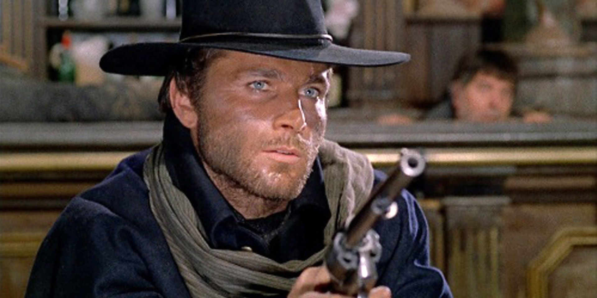 Franco Nero holding a pistol in Django