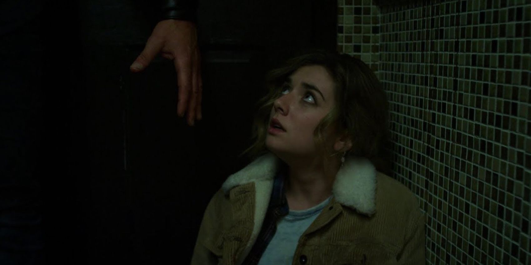Frank Castle reaches a hand down to Amy Bendix in The Punisher