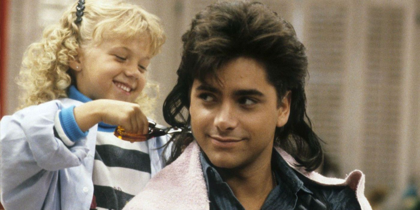 Stephanie cutting Jesse's hair while he smiles on Full House
