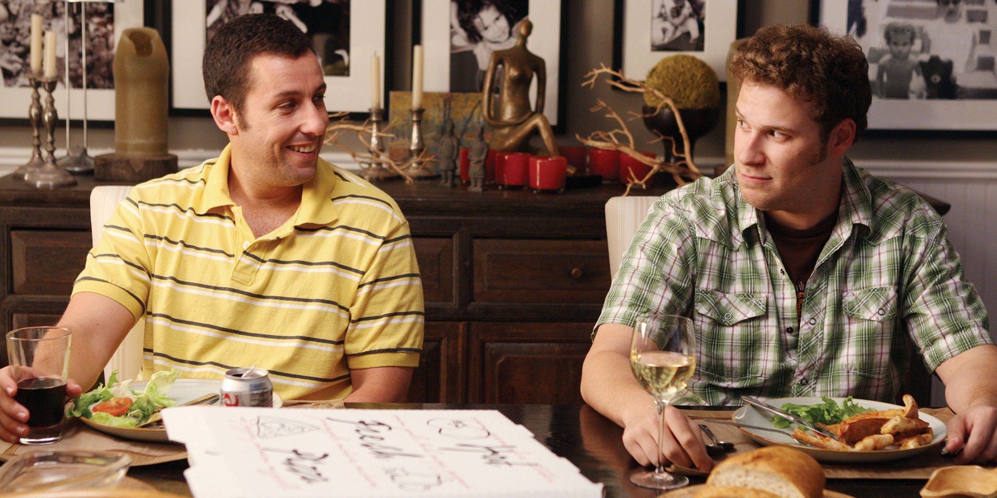 Seth Rogen and Adam Sandler at an awkward dinner party in Funny People
