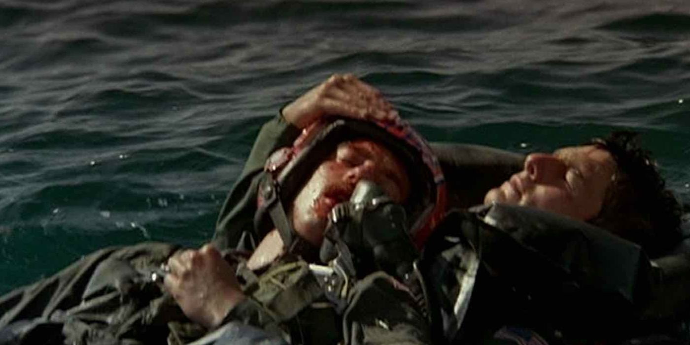 Maverick holding Goose's dead body in the water in Top Gun