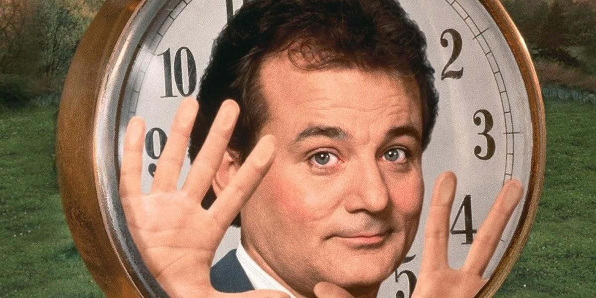 Bill Murray inside a clock in the Groundhog Day poster