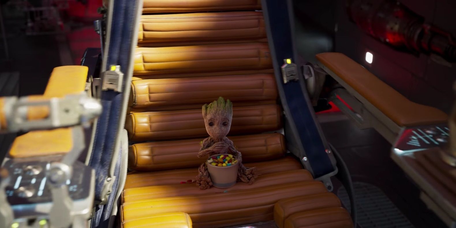 Baby Groot sits on a seat