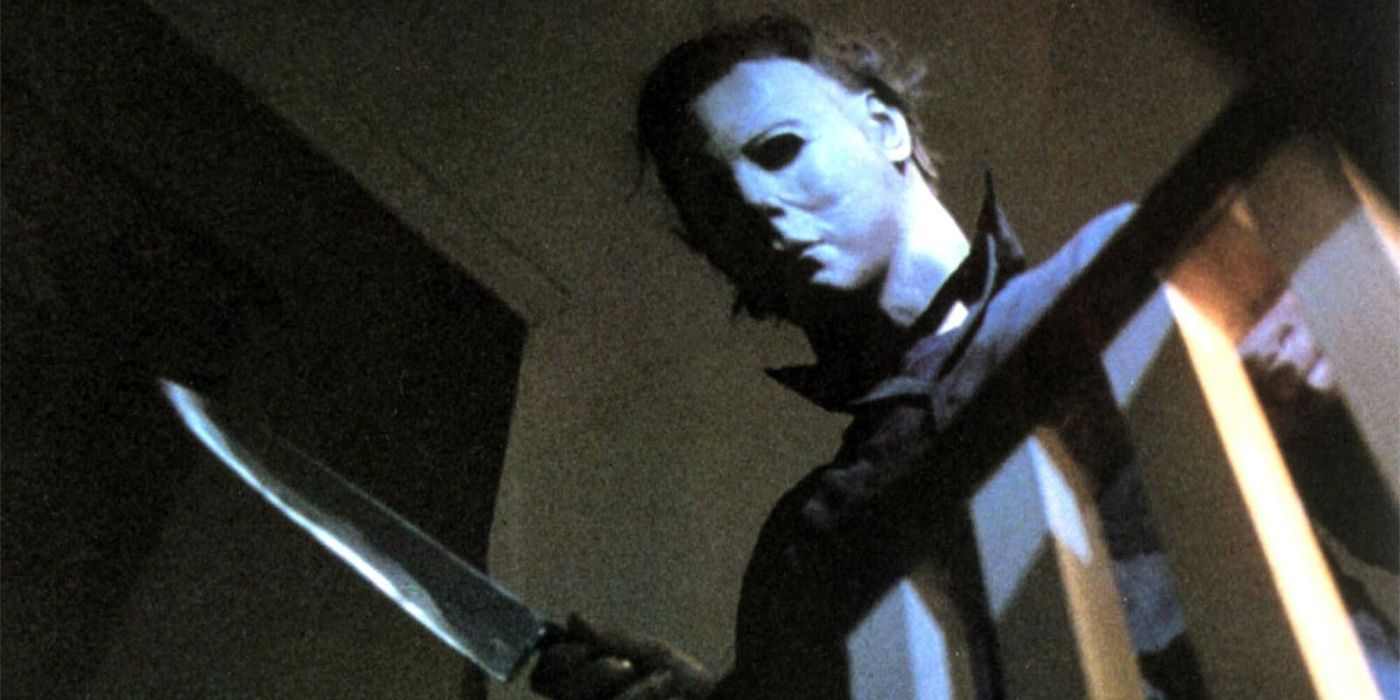Michael holding a knife above the stairs in Halloween