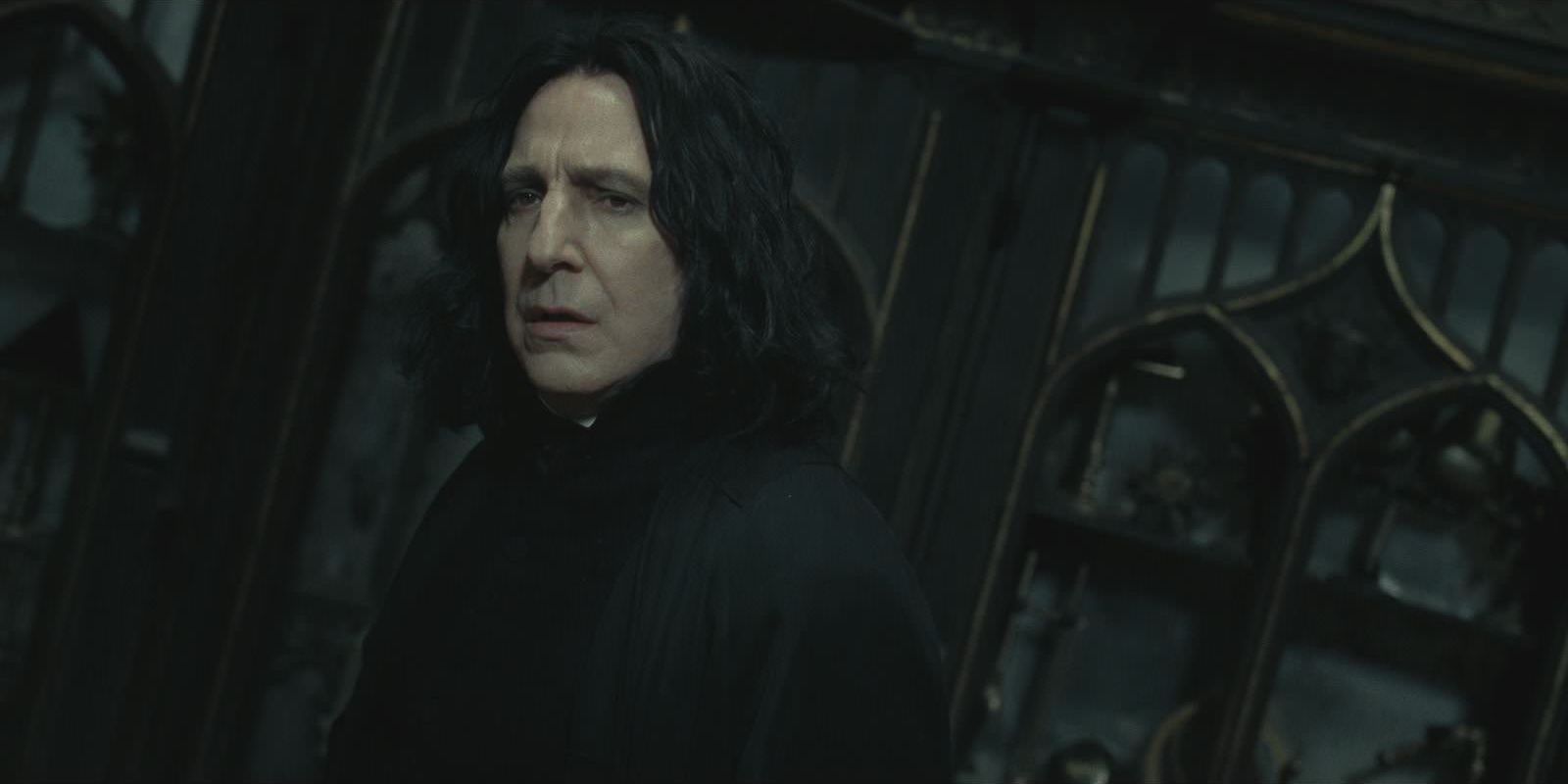 Snape looking confused in a dark room in Harry Potter