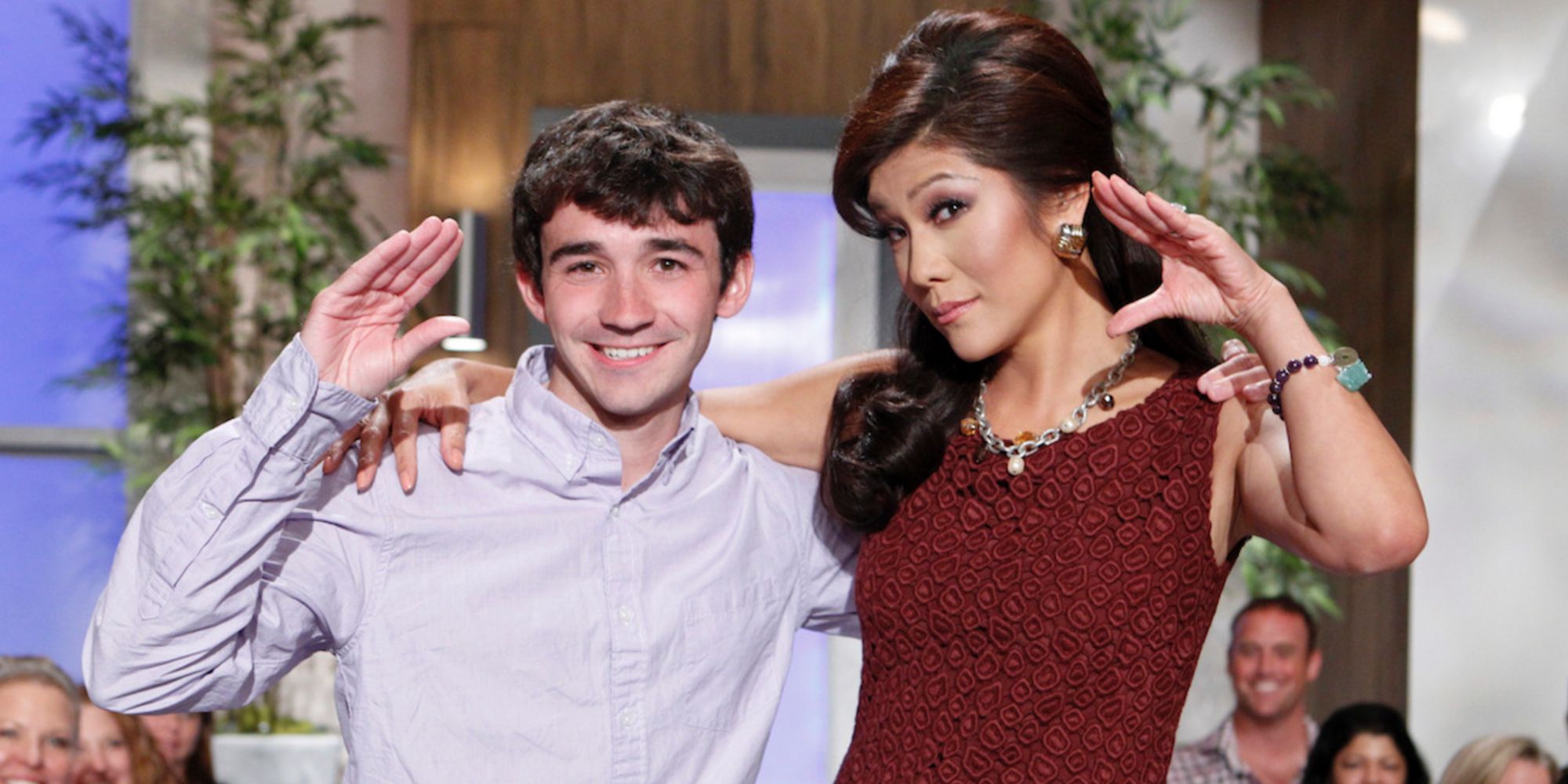 Ian Terry and Julie Chen on Big Brother 14 posing with their hands up