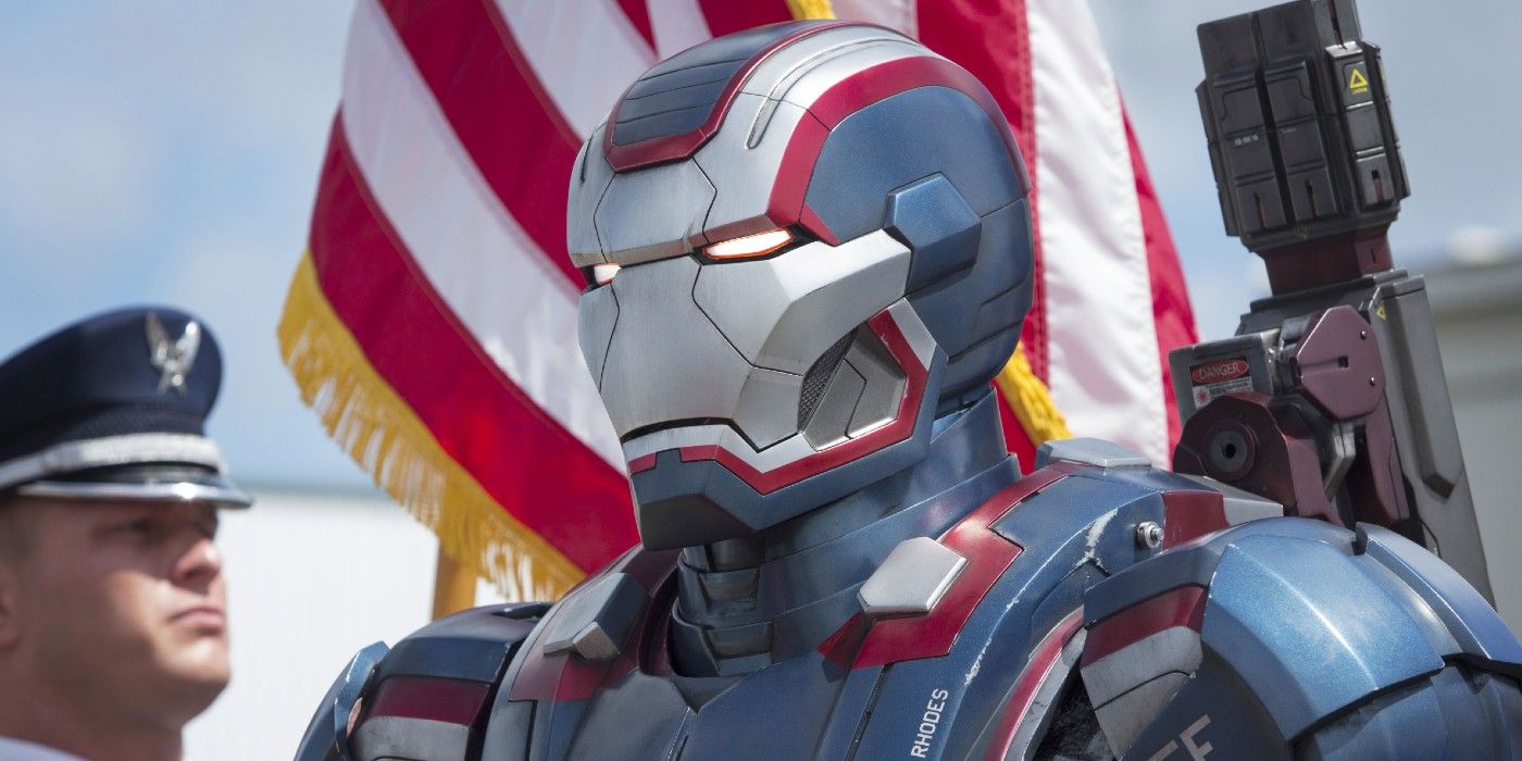 Iron Patriot stands before an American flag in Iron Man 3