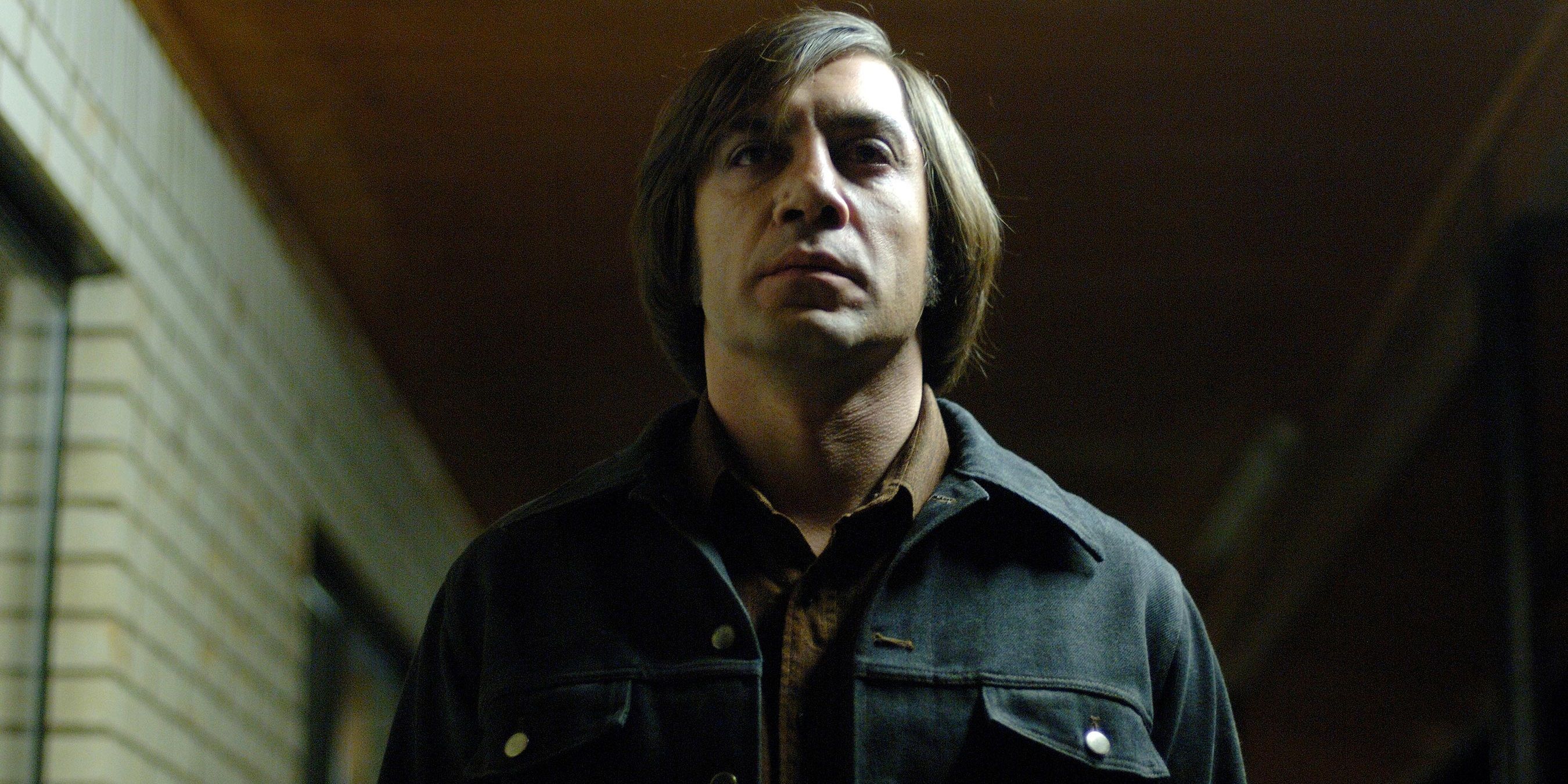 Javier Bardem as Anton Chigurgh walking in the shadows in No Country for old Men 2007