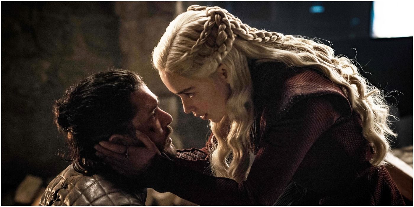 Daenerys Targaryen clutching on to Jon Snow's head