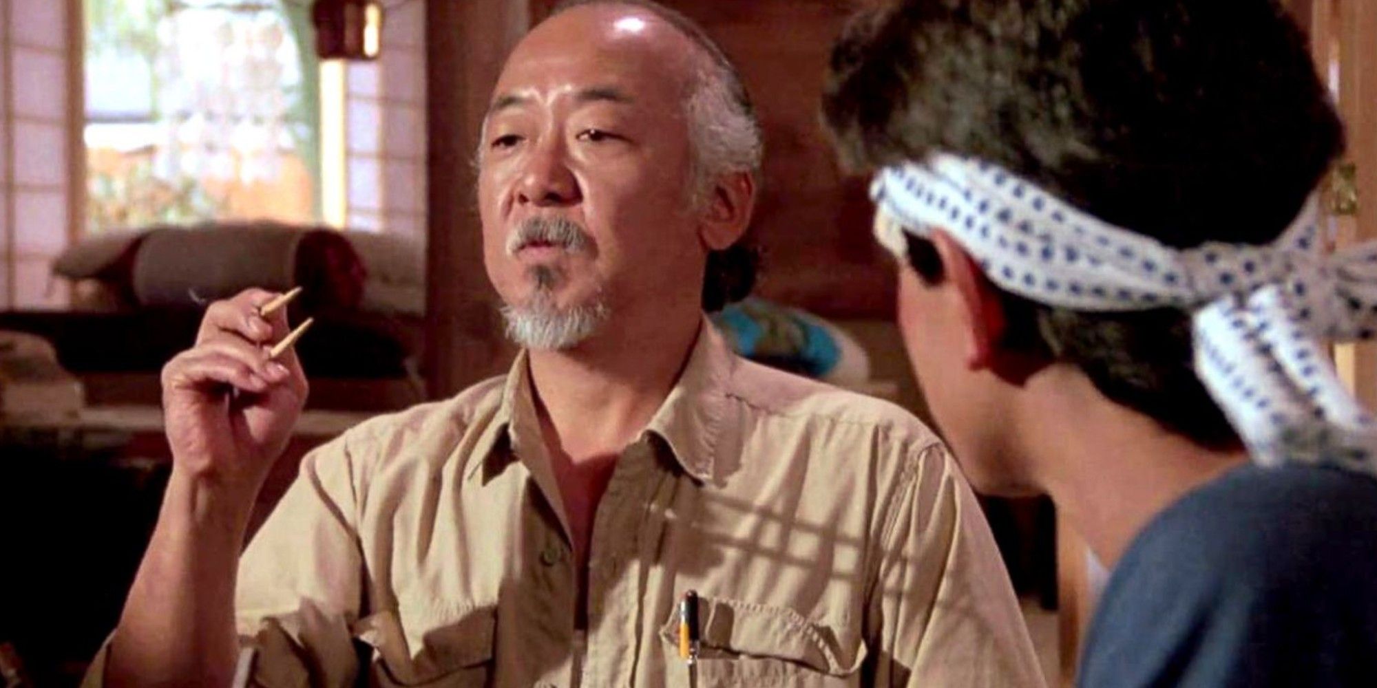 Mr. Miyagi trying to catch the fly with chopsticks in Karate Kid