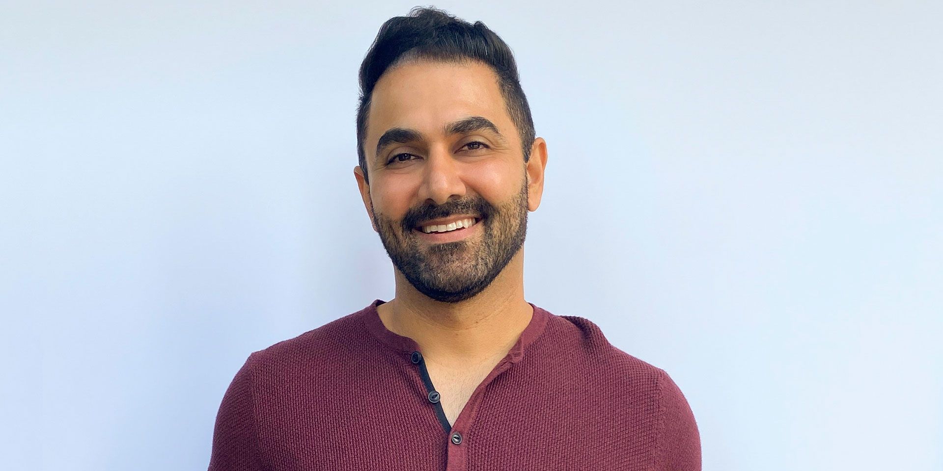 Kaysar Ridha smiling for the camera in Big Brother All-Stars