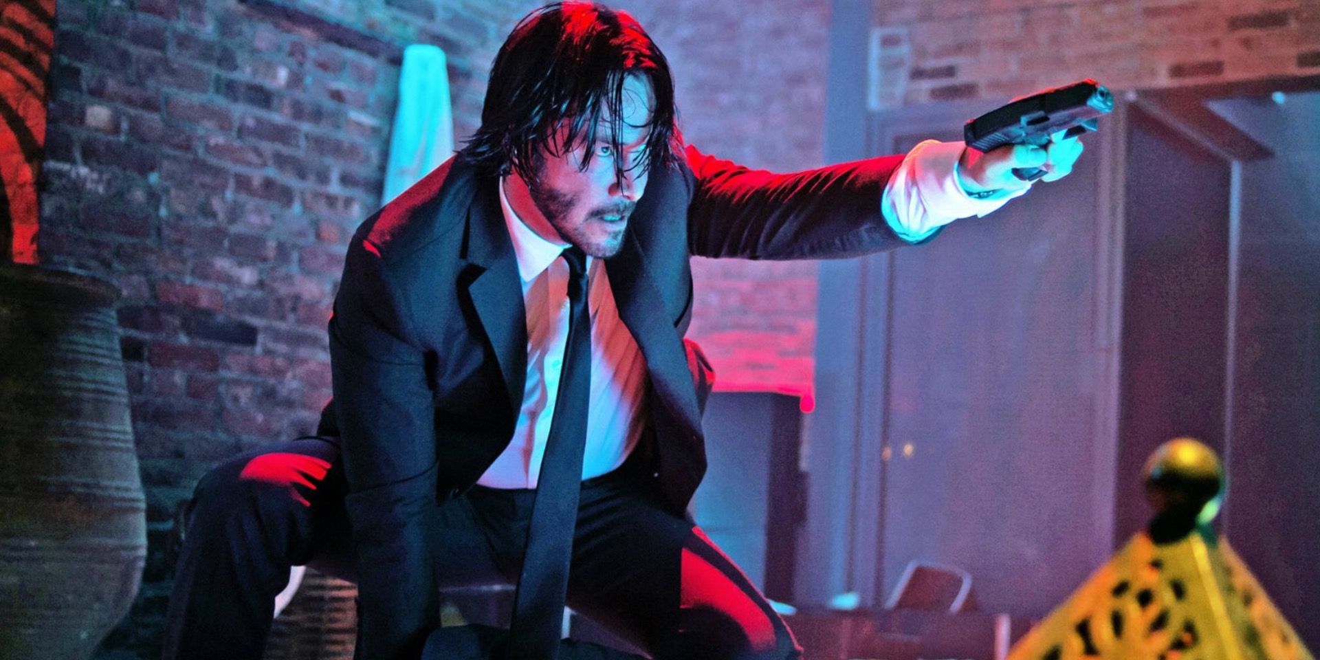 Keanu Reeves as John Wick in the Red Circle nightclub
