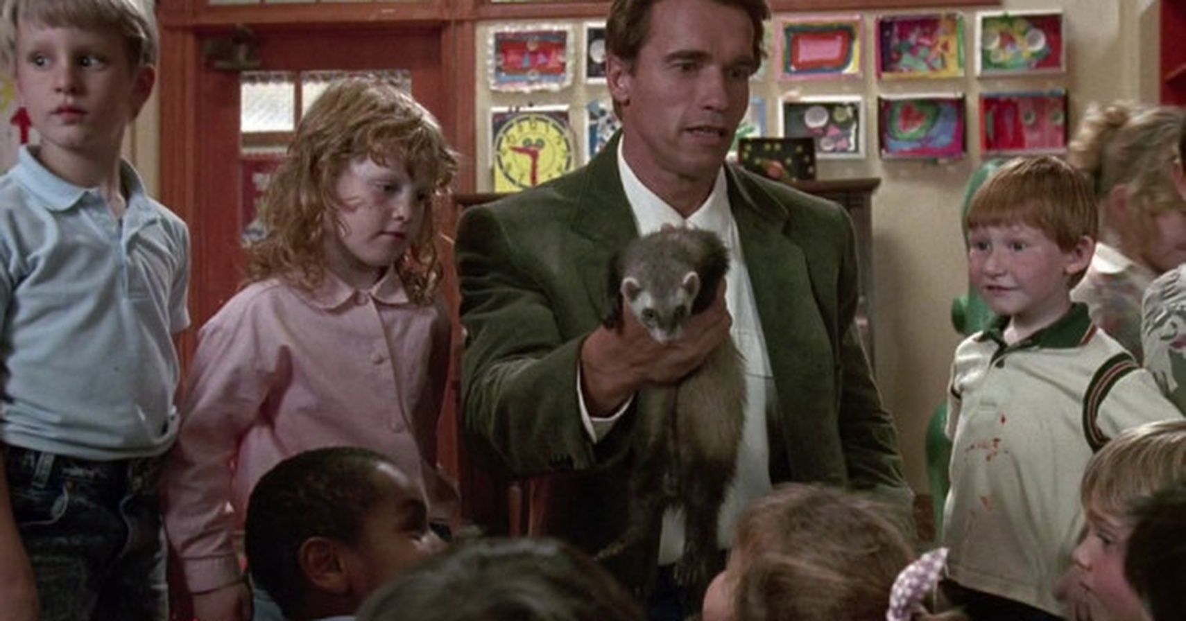Arnold Schwarzenegger in Kindergarten Cop surrounded by children