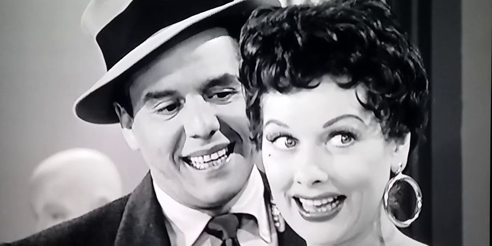 Ricky and Lucy smiling in an episode of I Love Lucy.