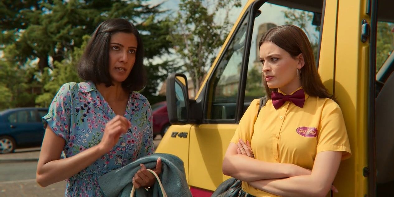 An image of Maeve Wiley and Emily Sands standing outside a school bus in Sex Education