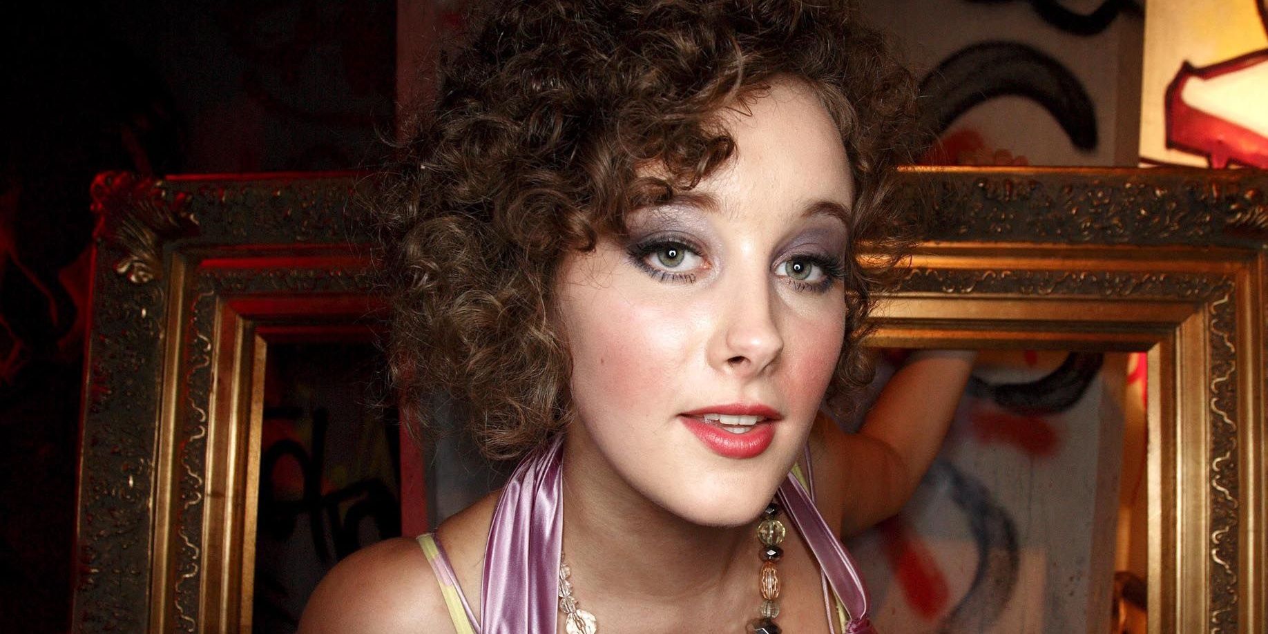Michelle from Skins looks into the camera