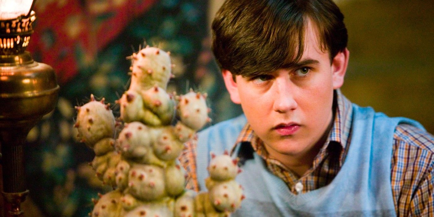 Neville Longbottom with a plant in Harry Potter