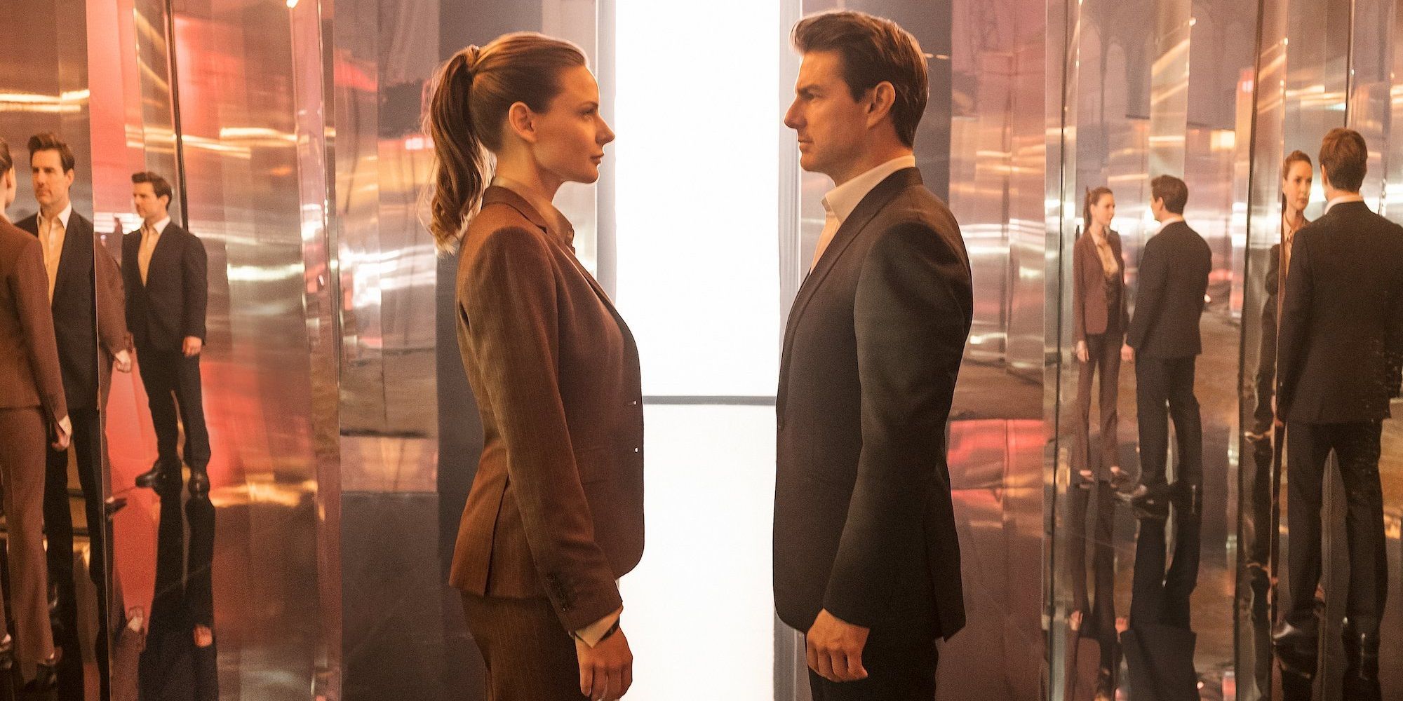 Ethan and Ilsa facing each other in Paris in Mission: Impossible – Fallout (2018)