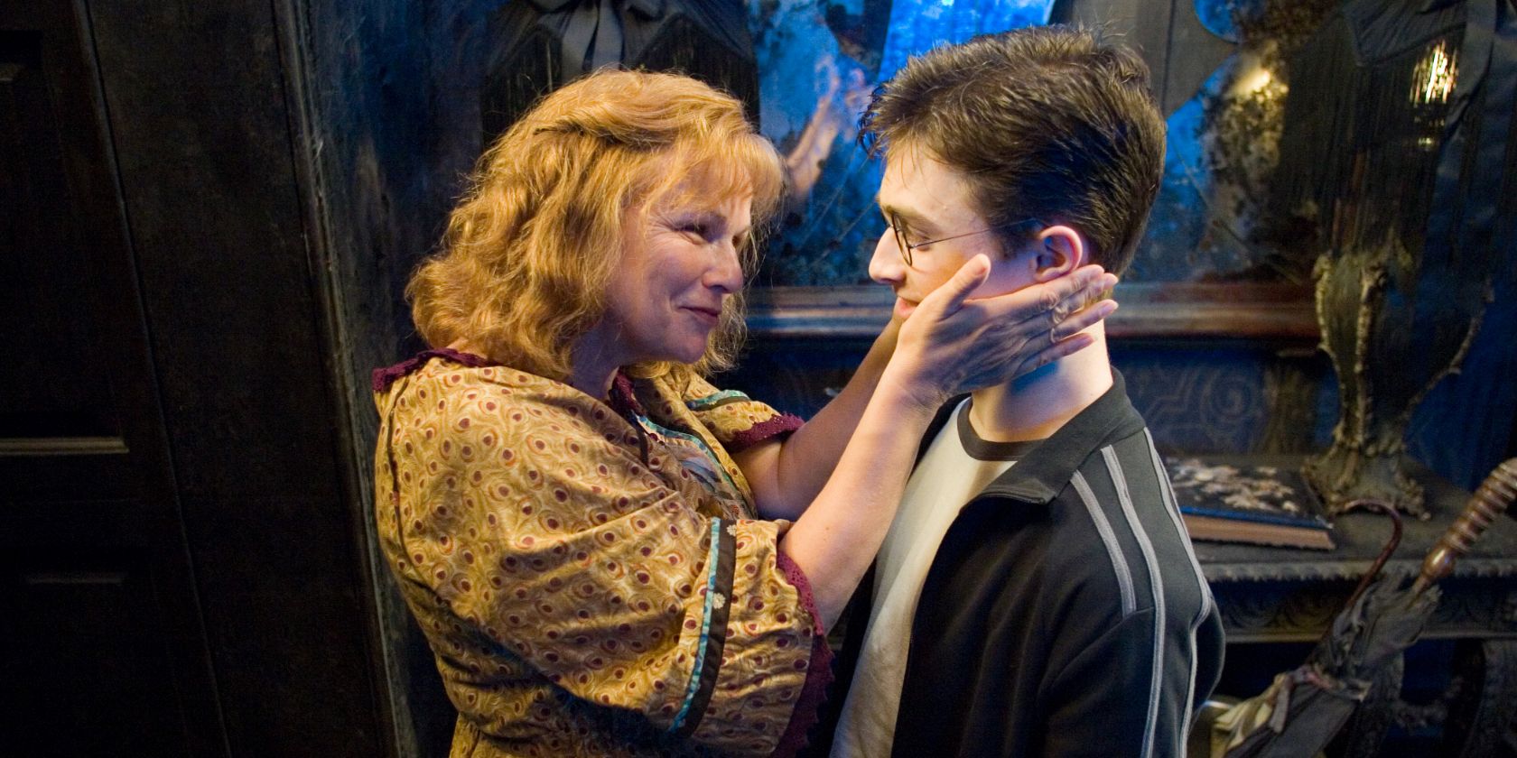 Molly holding Harry's face affectionately in Harry Potter and the Order of the Phoenix.