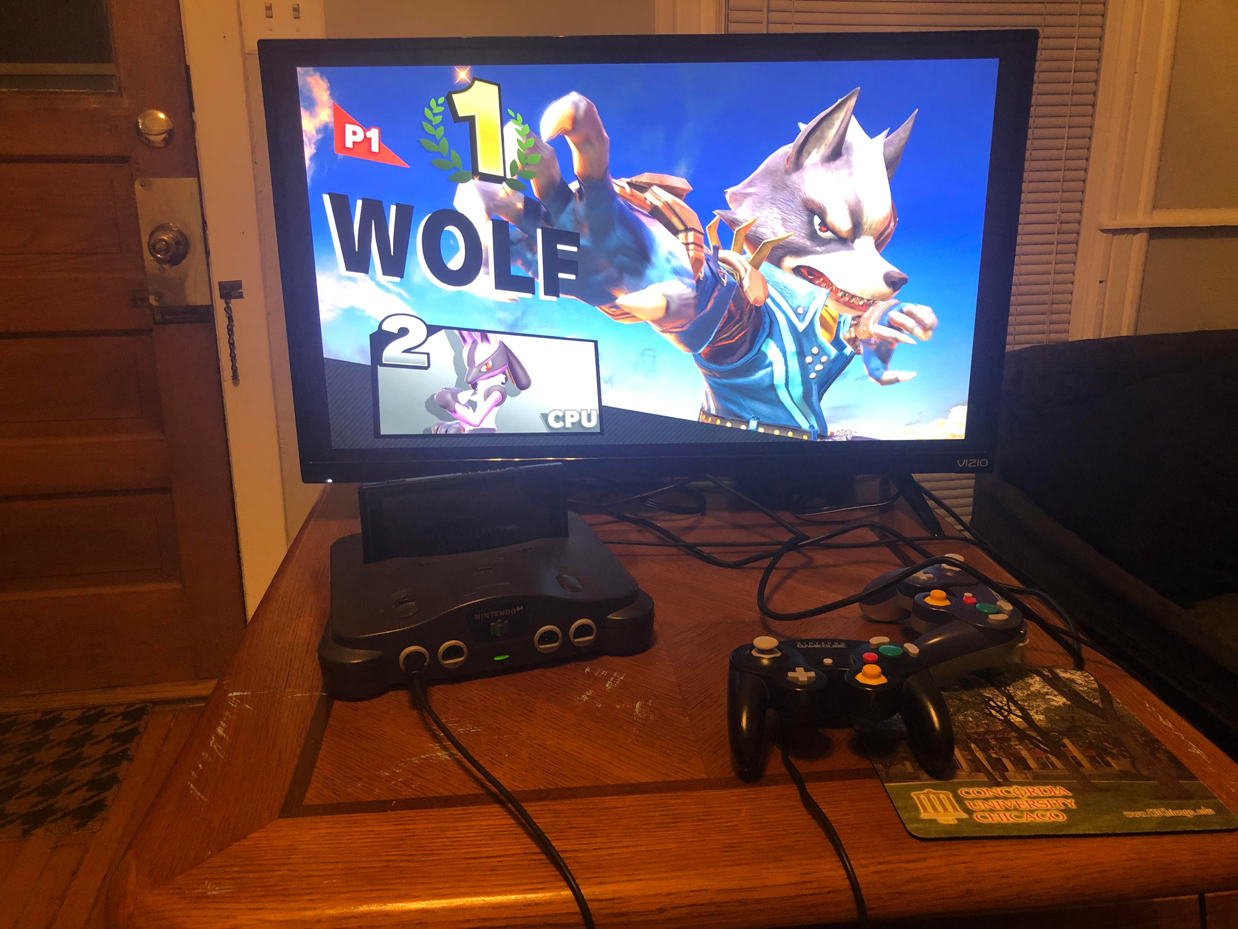 A Nintendo Switch dock made using a GameCube adapter and an old Nintendo 64 console.