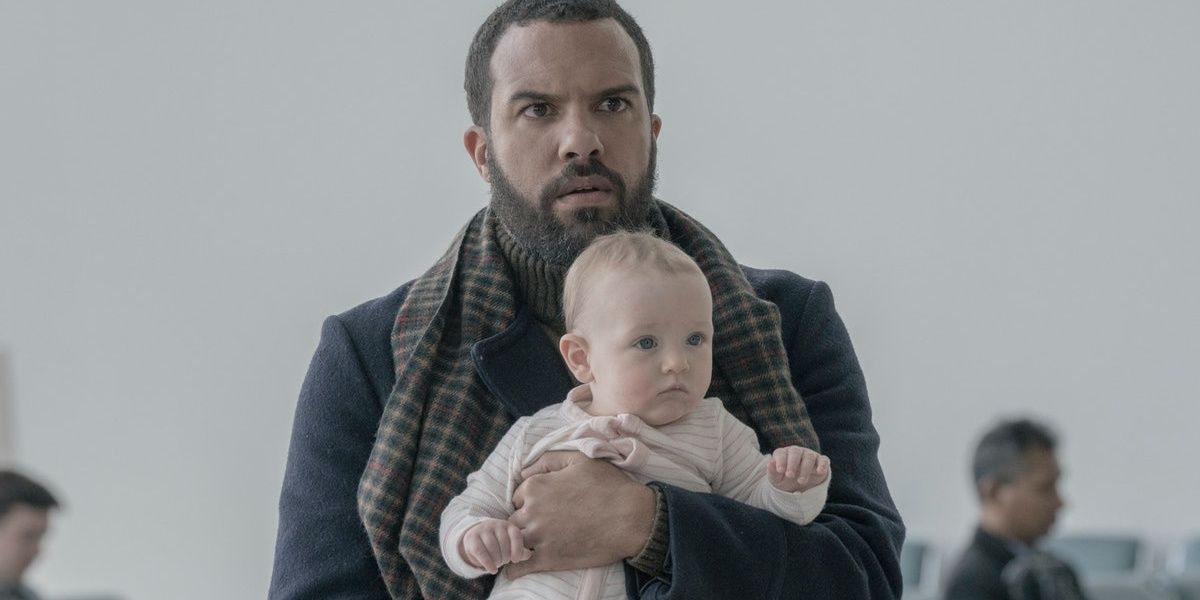O-T Fagbenle holds a baby in The Handmaid's Tale