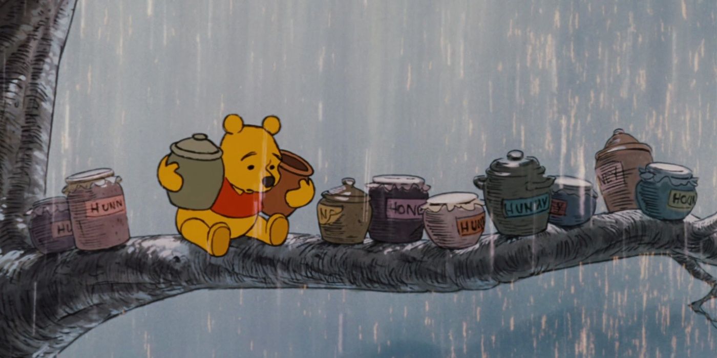 Pooh tentando resgatar seu mel em um galho de árvore